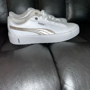Brand New Womens size 9.5 white Pumas.